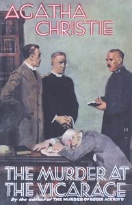 The cover art for the UK FIrst Edition of The Murder at the Vicarage by Agatha Christie shows a dead man slumped over a desk, while three men stand nearby, talking.