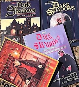 An array of four books about the 1960s television series Dark Shadows, including an almanac and a scrapbook. 