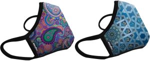 Two colorful cloth masks from Vogmask shown side by side. On the left is "Candide" which has a paisley pattern in shades of purple, blue, green, pink, and orange. On the right is "Chakra" which has a blue geometric pattern with mandalas in shades of blue and green. Both maks have black trim and black ear straps.