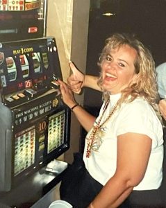 Peggy playing the slot machines.